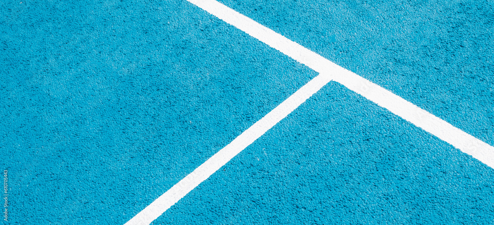 Sport field court background. Light blue rubberized and granulated ground surface with white lines. Top view