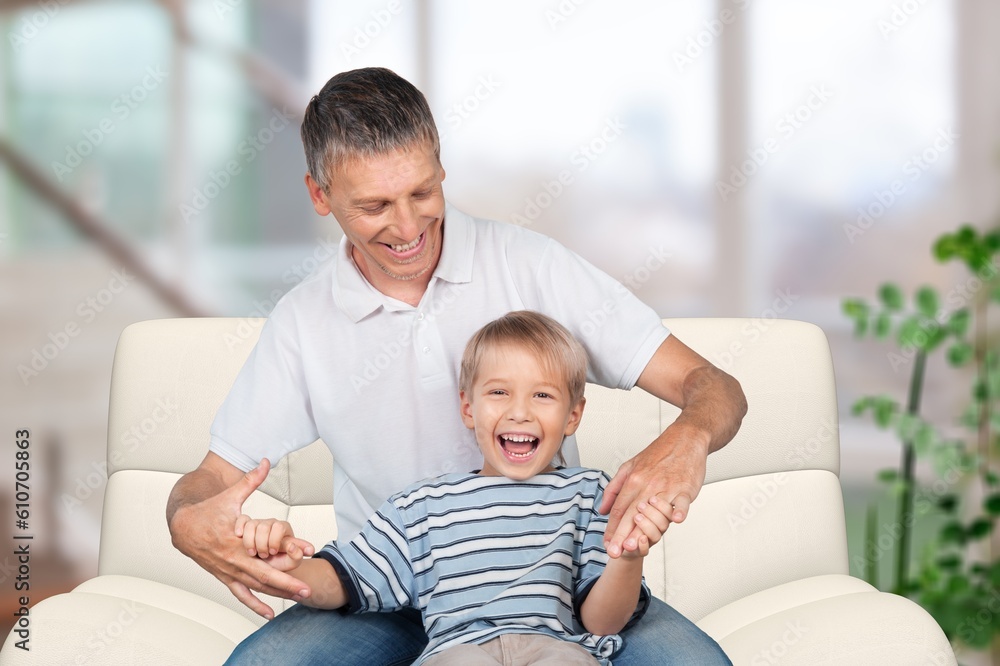 Obraz premium Joyful and happy dad playing with child at home