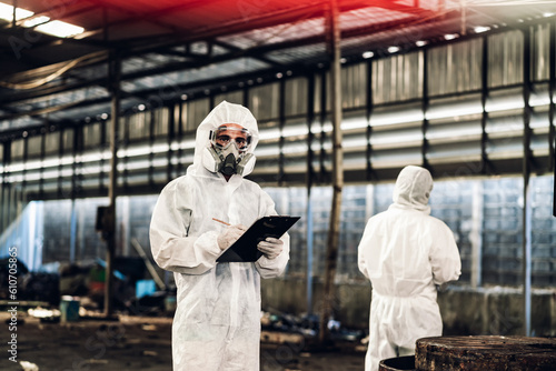 Scientist wear Chemical protection suit check danger chemical, working at dangerous zone. Healthcare workers wearing hazmat suits working together to control an outbreak