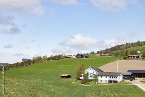Farm landscape with houses in the background,Tysnset,Tynset is a municipality in Østerdalen in Innlandet county.,Norway photo