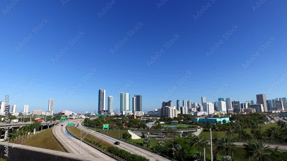 Panning Pov Of Vehicles On Bridge Near Skyscrapers In City Against Clear Blue Sky - Miami, Florida Panning Pov Of Vehicles On Bridge Near Skyscrapers In City Against Clear Blue Sky - Miami, Florida