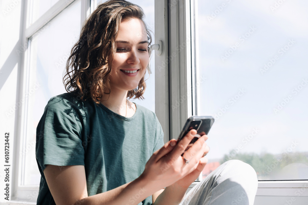 Connected in Solitude: A Young Woman Embraces Technology for Communication and Connection While Practicing Social Distancing at Home Connected in Solitude: A Young Woman Embraces Technology for Communication and Connection While Practicing Social Distancing at Home
