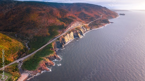 Billede på lærred Stunning Aerial views of the world famous Cabot Trail over looking Cap Rouge, Cape Breton Highlands in the peak autumn fall season with mixed color deciduous trees
