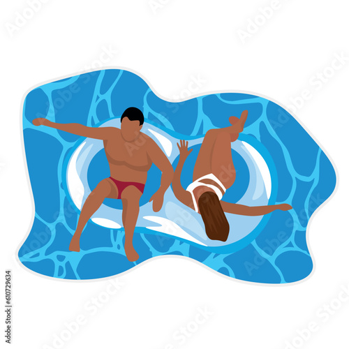 Couple relaxing on inflatable rings in swimming pool  top view