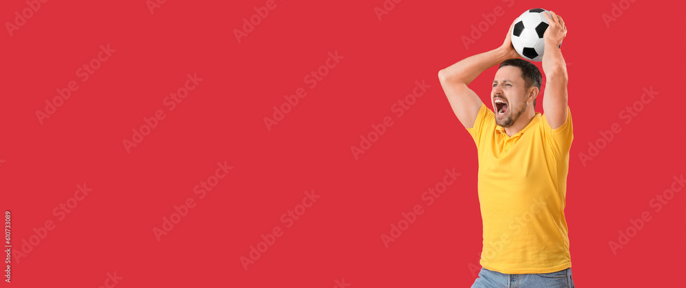 Emotional man with soccer ball on red background with space for text Emotional man with soccer ball on red background with space for text