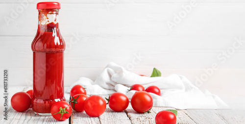 Bottle of ketchup and tomat...