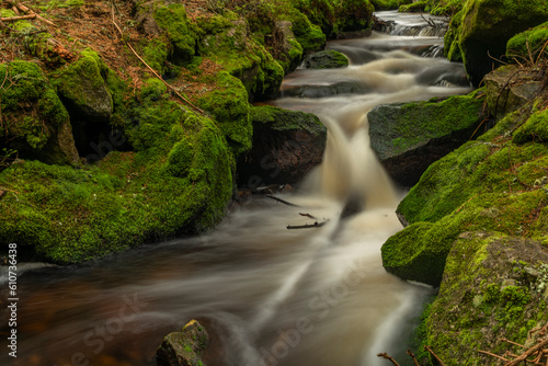 Waterfall on Lesni creek in Sumava national park in spring day photo