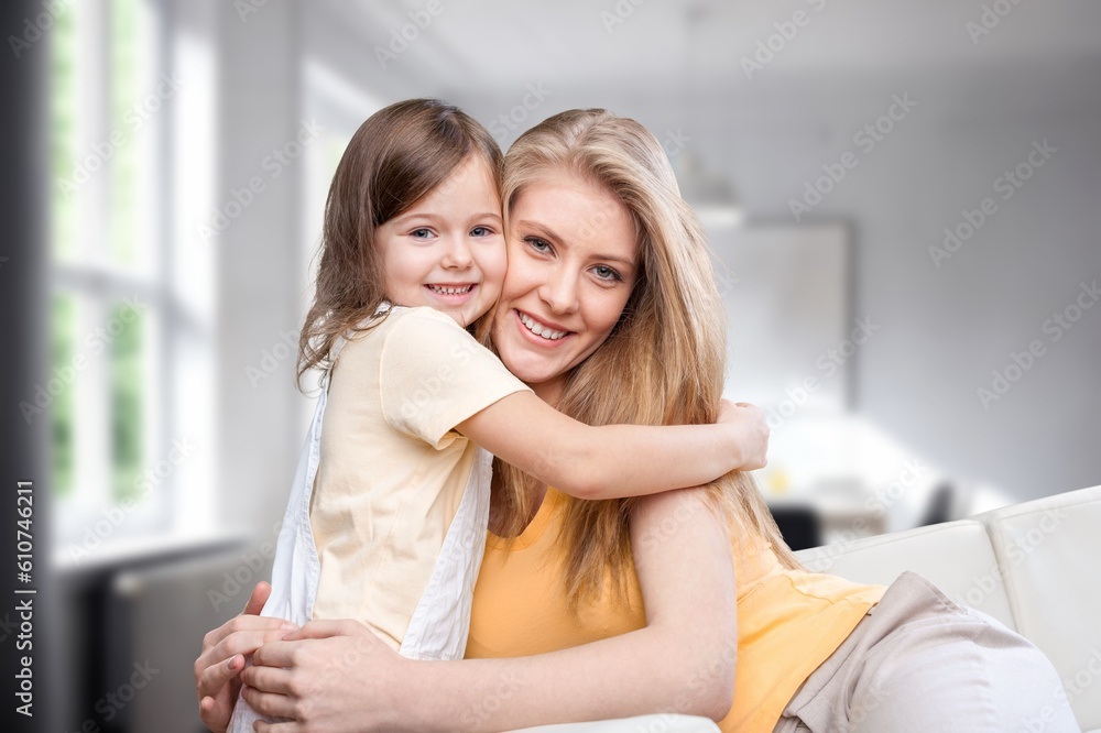 Happy child hugs young mother Happy child hugs young mother