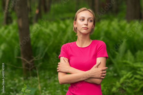 girl teenager in a pink dress on a natural background