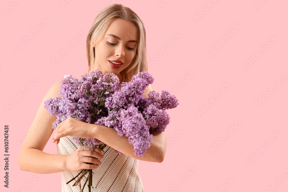 Young woman with lilac flowers on pink background Young woman with lilac flowers on pink background