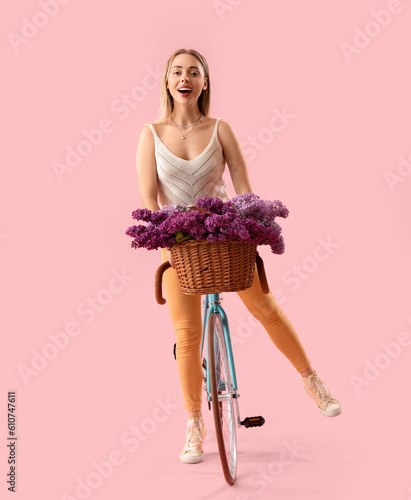 Young woman with lilac flow...