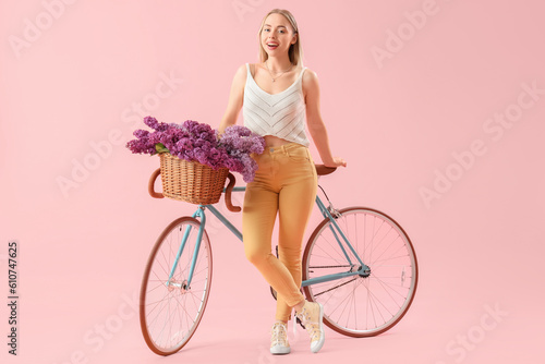 Young woman with lilac flow...
