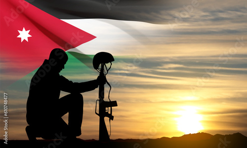 Silhouette of a soldier kneeling down with Jordan flag on background of sunset sky. Concept - Independence Day, Armed Force. EPS10 vector
