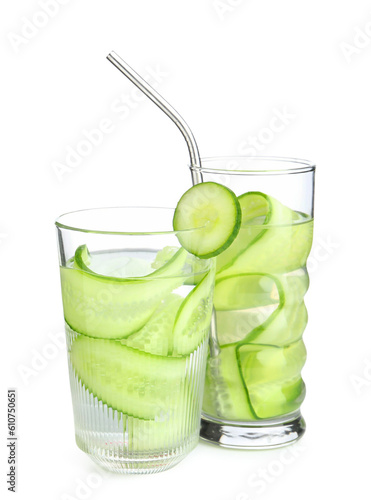 Glasses of infused water with cucumber slices on white background