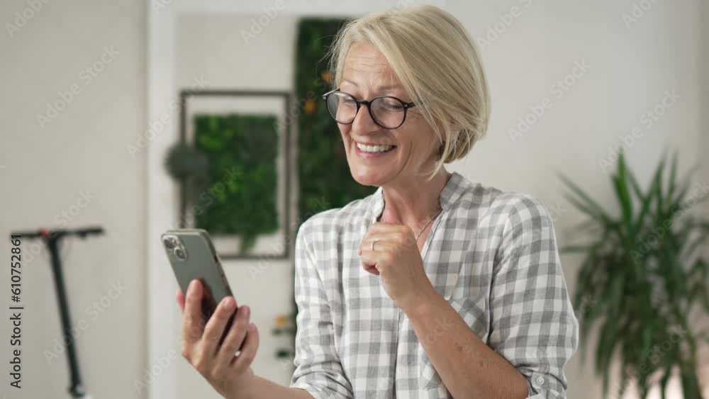 mature woman woman use smartphone for video call indoor at home work mature woman woman use smartphone for video call indoor at home work