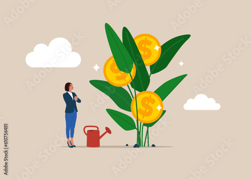 Obraz na płótnie Woman finish watering growing money plant seedling with coin flower