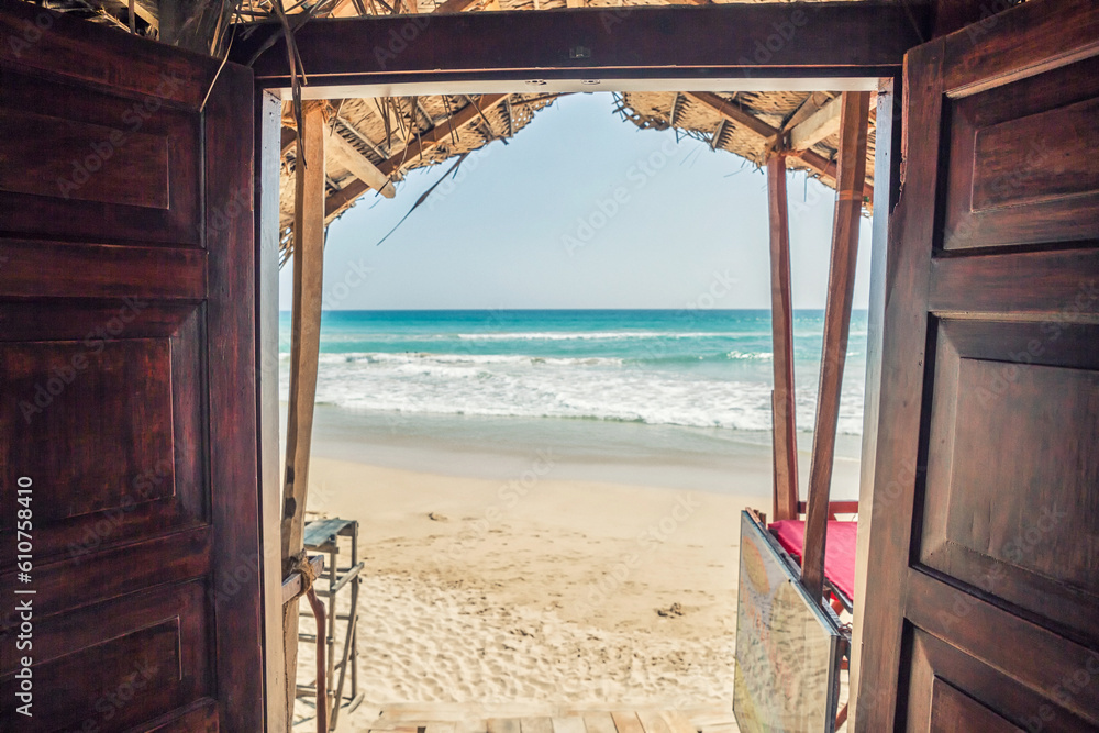 wooden door to the beach and indian ocean