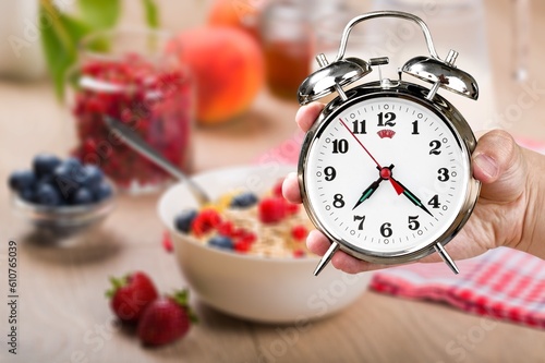 Classic alarm clock and breakfast. Diet concept