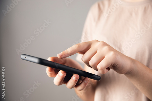 women holding a phone and bank cart