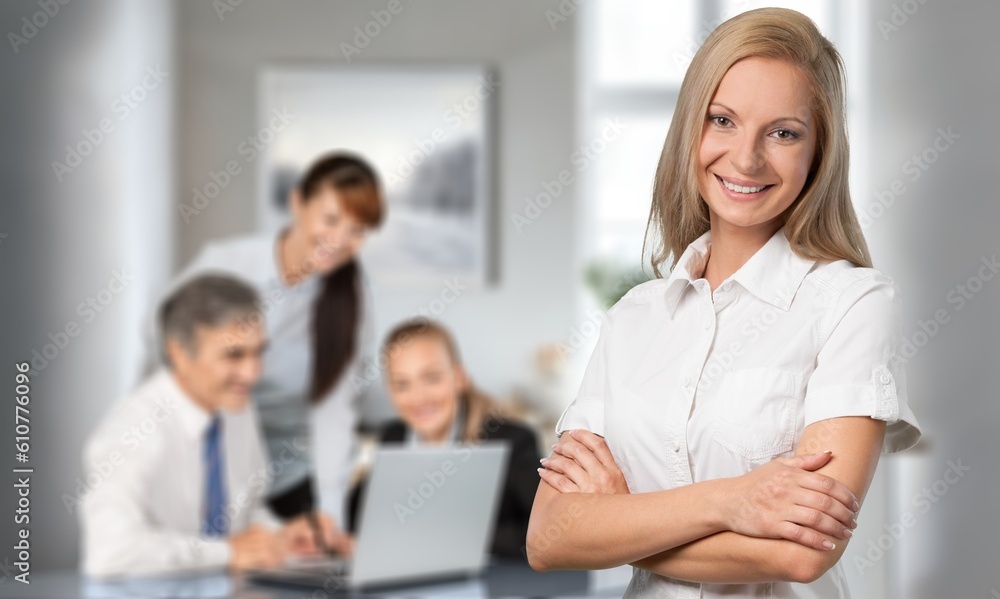 Happy young woman posing in office Happy young woman posing in office