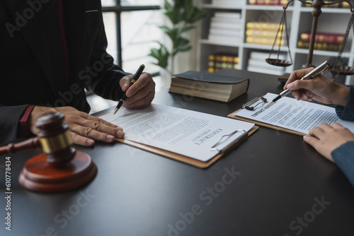 Attorneys or lawyers who are reading the statute of limitations Consultation between male lawyers and business clients, tax and legal and legal services firms.