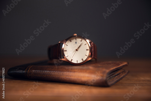 Wallpaper Mural brown watch in brown wallet on the wooden table Torontodigital.ca