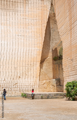 ladder to the bottom of a deep impressive sandstone quarry