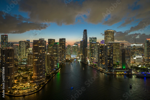 View from above of brightly illuminated high skyscraper buildings in downtown district of Miami Brickell in Florida, USA. American megapolis with business financial district at night © bilanol
