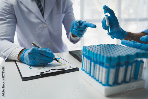 Canvastavla medical research laboratory A team of scientists or doctors use in vitro solutions to analyze data in a medical science laboratory
