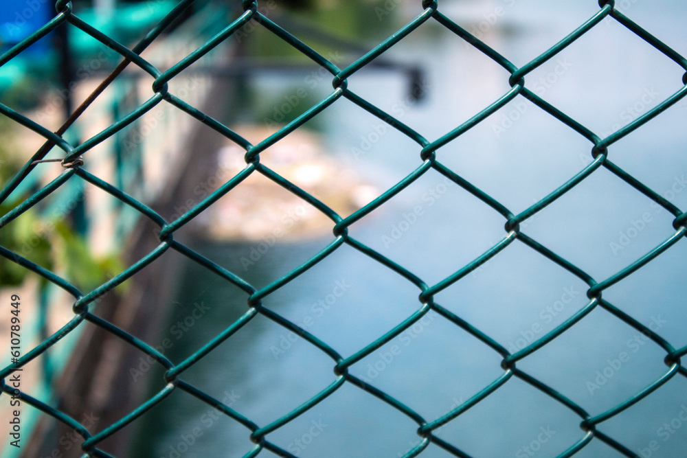 Chain wire mesh fence links macro close up shot shallow depth of field. Chain wire mesh fence links macro close up shot shallow depth of field.