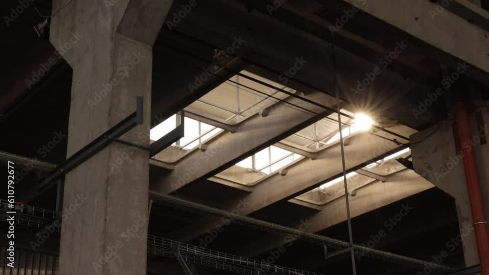 Ceiling window, Factory lighting, Thermal performance. Walls industrial structure bathed sunlight as it pours in through ceiling window. Ceiling window, Factory lighting, Thermal performance. Walls industrial structure bathed sunlight as it pours in through ceiling window.