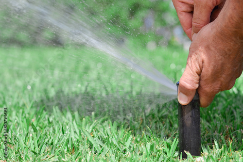 Obraz na plátně Manual sprinkler adjustment