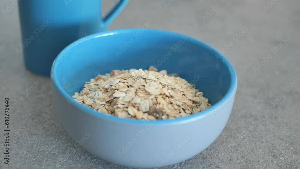 roasted oats flakes in a blue color bowl on table roasted oats flakes in a blue color bowl on table
