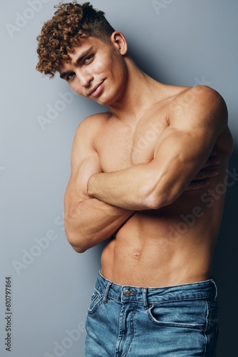 Tableau sur toile man person gray background healthy studio young guy gray muscle muscular shirtle