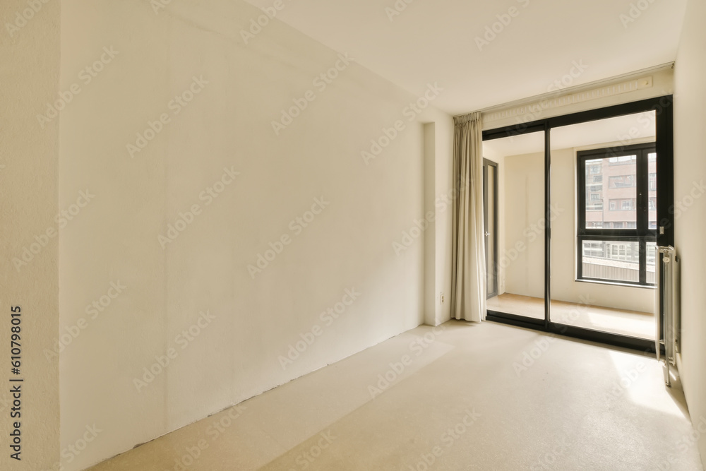 an empty living room with white walls and black trim around the window panoray, new york, ny an empty living room with white walls and black trim around the window panoray, new york, ny