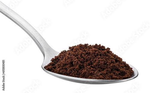 Ground coffee in spoon isolated on white background