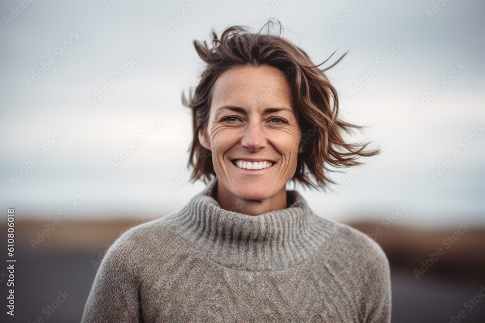 Portrait of a smiling woman looking at the camera on the beach Portrait of a smiling woman looking at the camera on the beach