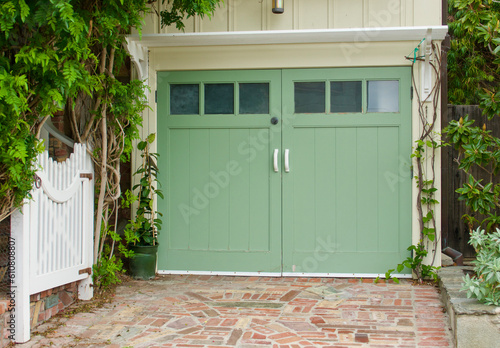 vintage bungalow with a trellis over the one car garage photo