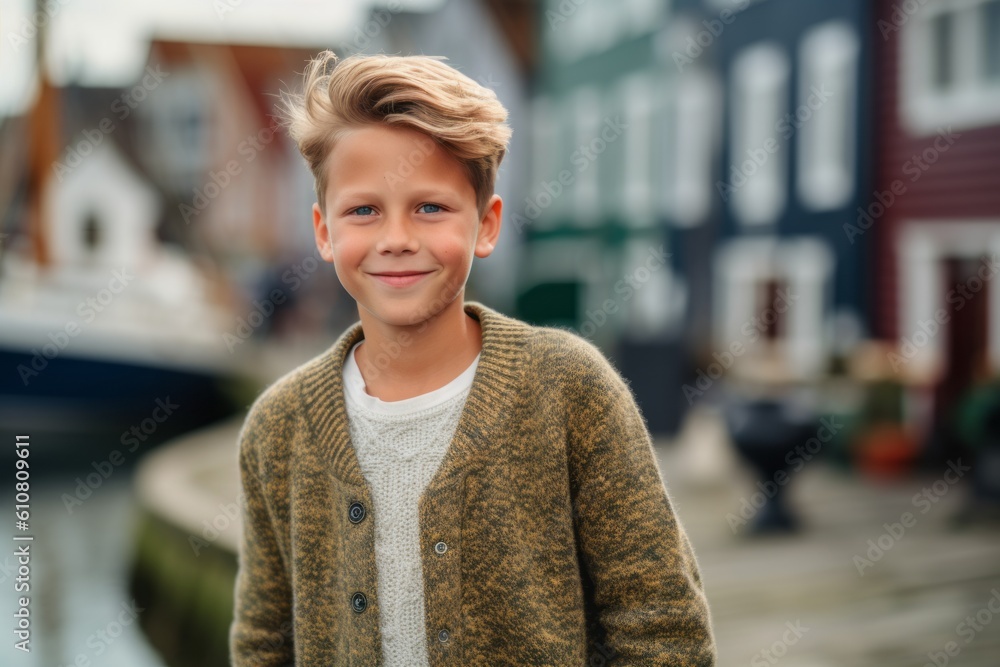 Medium shot portrait photography of a grinning child male that is wearing a chic cardigan against a picturesque fishing village with boats and seagulls background . Generative AI Medium shot portrait photography of a grinning child male that is wearing a chic cardigan against a picturesque fishing village with boats and seagulls background . Generative AI