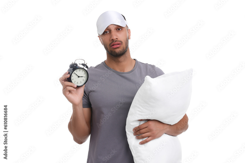 Tired man with pillow, sleep mask and alarm clock on white background. Insomnia problem Tired man with pillow, sleep mask and alarm clock on white background. Insomnia problem