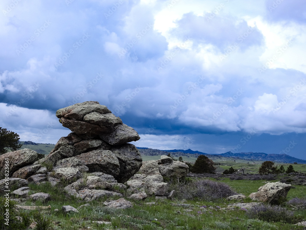 Big Rocks on a Mountain with Storm Clouds and Rain in the Background Big Rocks on a Mountain with Storm Clouds and Rain in the Background