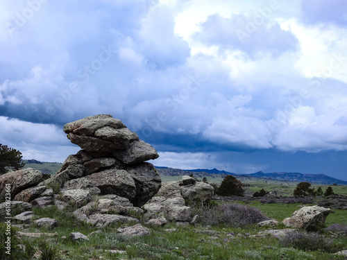 Big Rocks on a Mountain with Storm Clouds and Rain in the Background