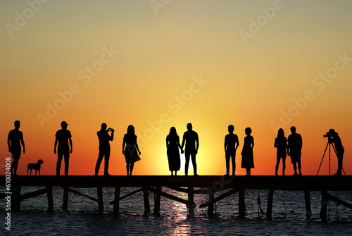 People getting ready for sunset on beach