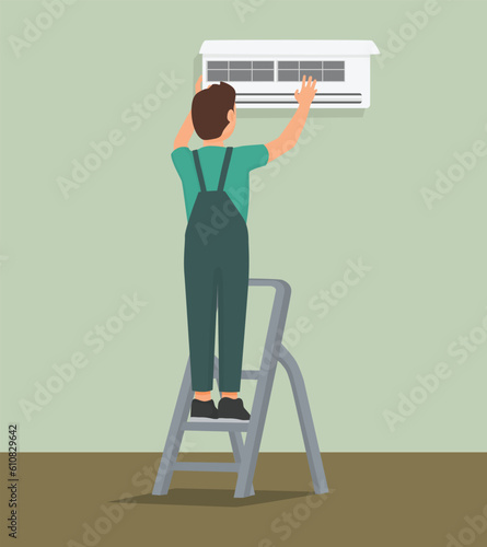 Technician service man repairing and cleaning Air Conditioning on the wall