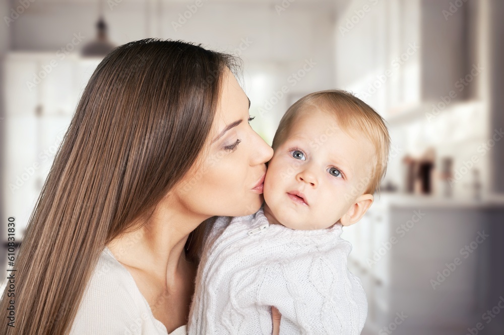 Happy beautiful young mother holding newborn baby Happy beautiful young mother holding newborn baby