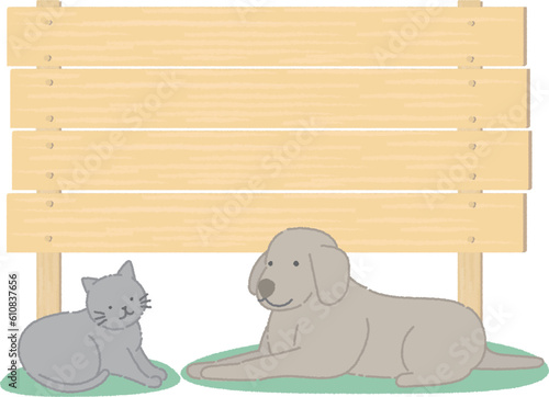 看板の前の可愛い犬と猫