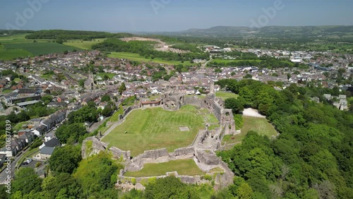 Denbigh Castle and Town Walls, Denbighshire, Wales - Aerial drone anti-clockwise distant pan from rear to side - June 23 photo