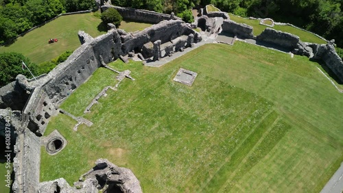 Denbigh Castle and Town Walls, Denbighshire, Wales - Aerial drone gimbal down flyover and rotate, castle reveal - June 23 photo