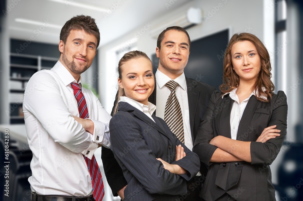 Group of smart young businesspeople in an office. Group of smart young businesspeople in an office.