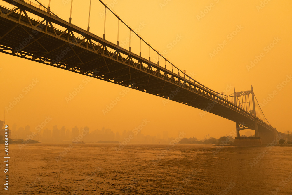 The Triborough Bridge along the East River in New York City with Massive Air Pollution from Wildfires The Triborough Bridge along the East River in New York City with Massive Air Pollution from Wildfires